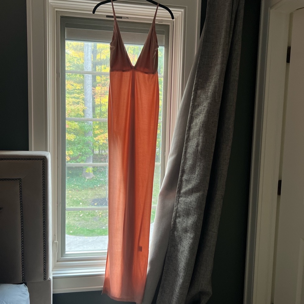 Long baby pink maxi dress with a high slit